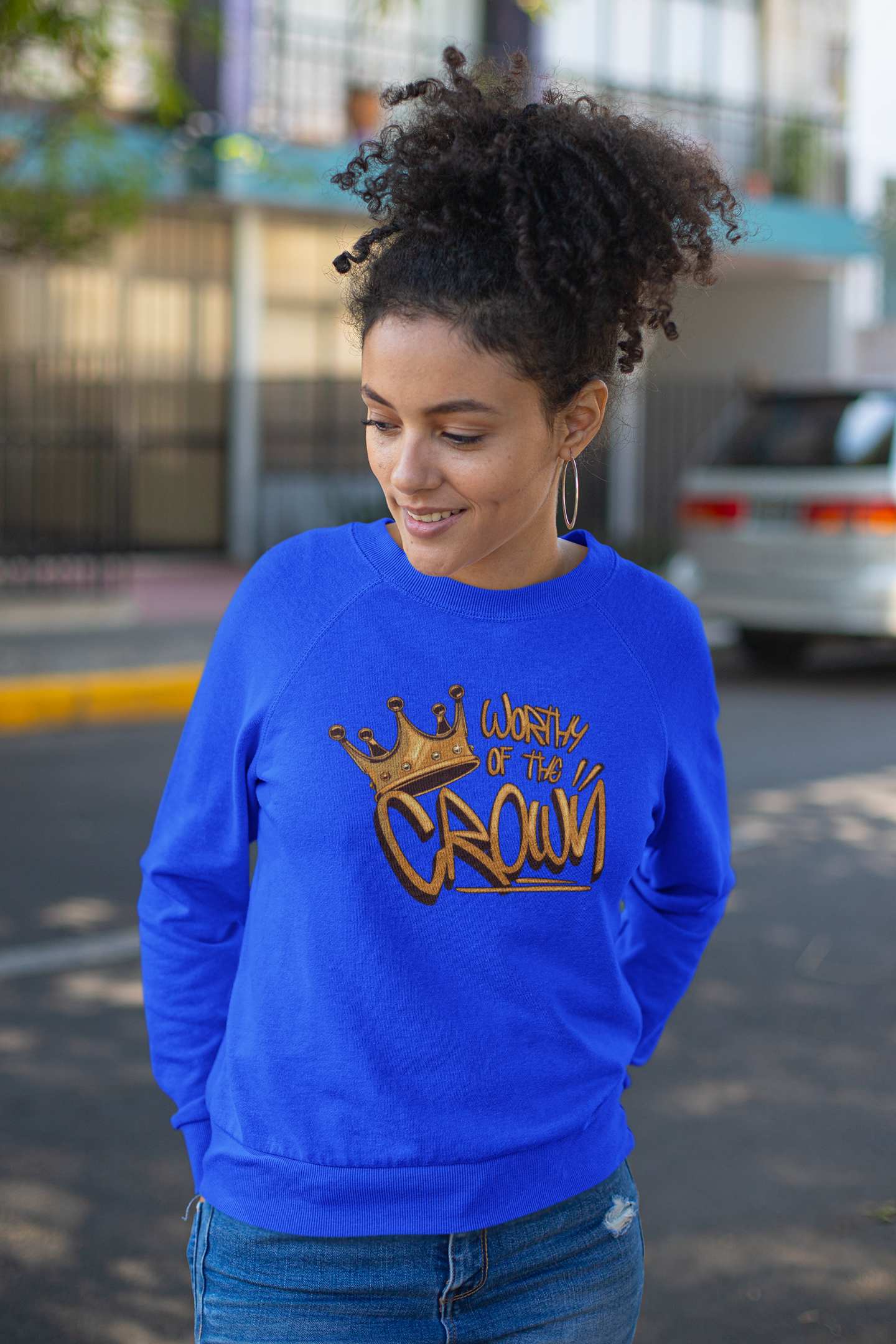 Woman in city wearing Blue sweatshirt