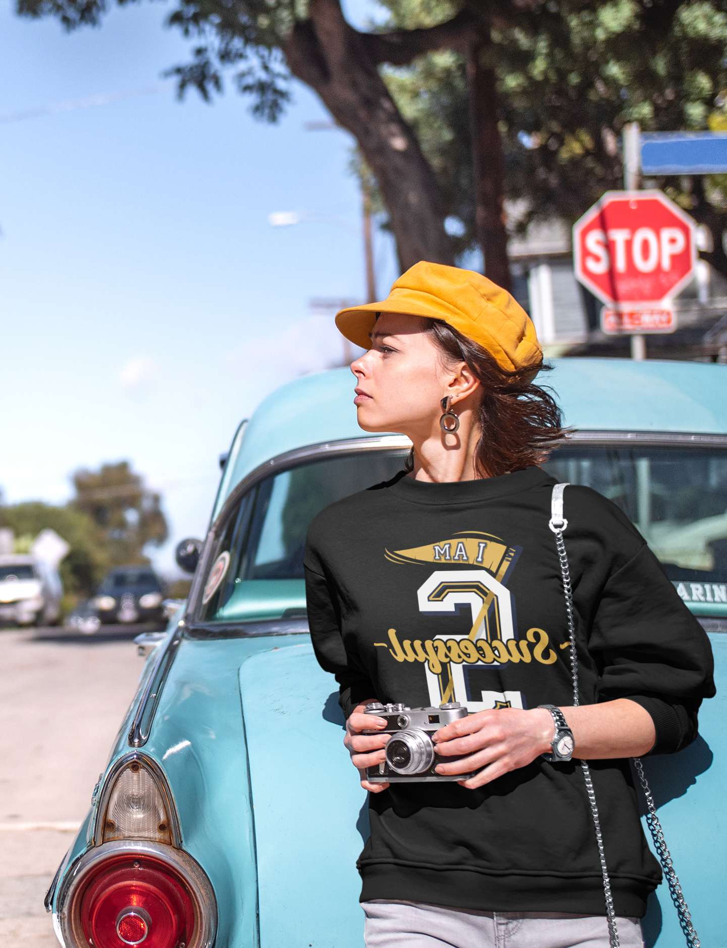 Woman in a "I Am Successful" mirror print sweatshirt, color black 